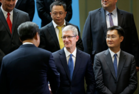 President Xi Jinping of China, lower left, greeting Apple’s chief executive, Tim Cook, in 2015. Mr. Cook has made frequent, statesmanlike visits to China. Associated Press