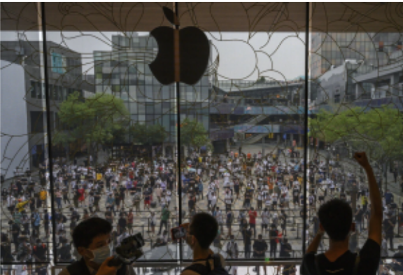 People waiting in line last year for the opening of a new Apple Store in Beijing. The company earns a fifth of its revenue in the China region. Kevin Frayer/Getty Images